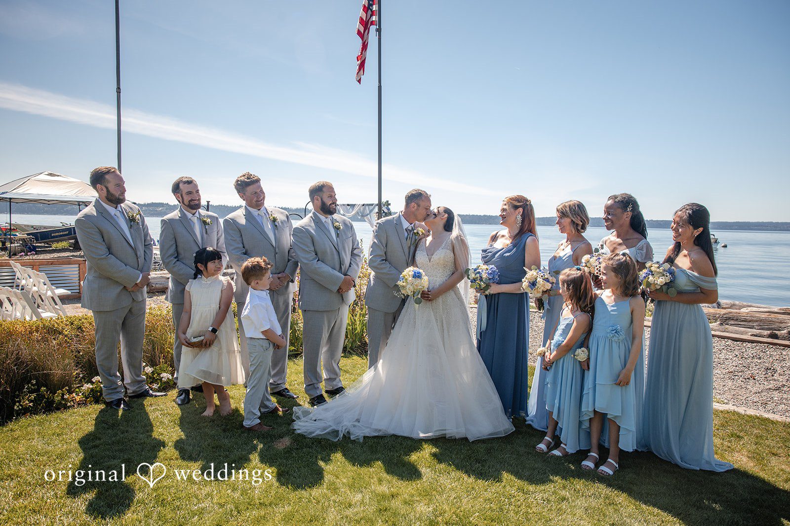 Kelly + John Wedding party lined up on the beach