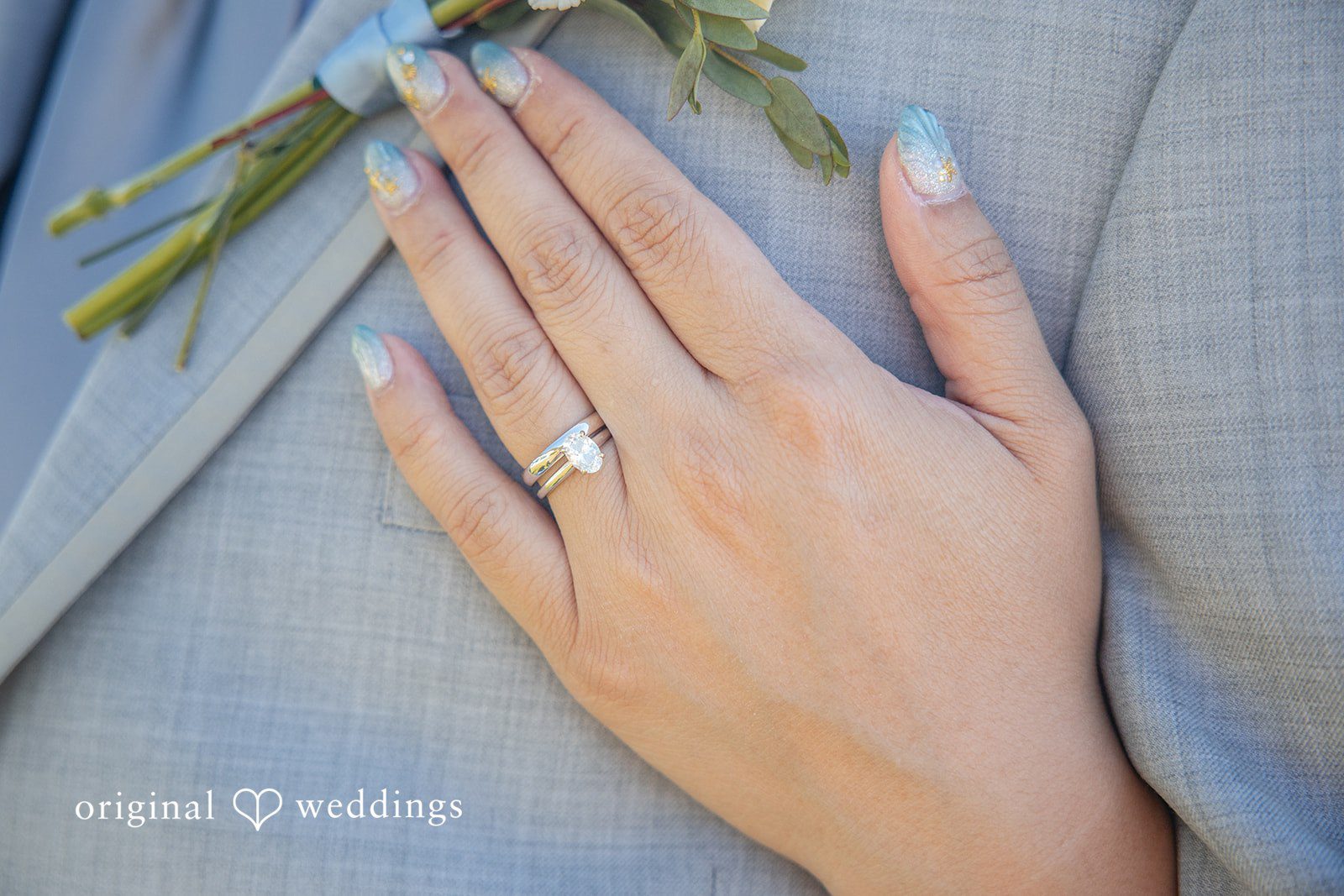 Kelly + John Bride resting her hand with her ring on the groom