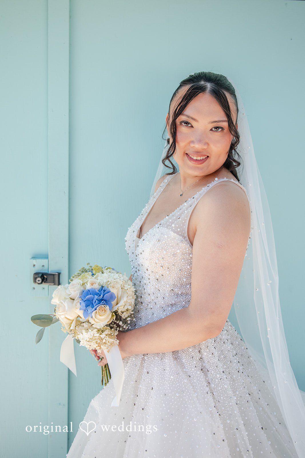 Kelly + John Bride portrait with her bouquet
