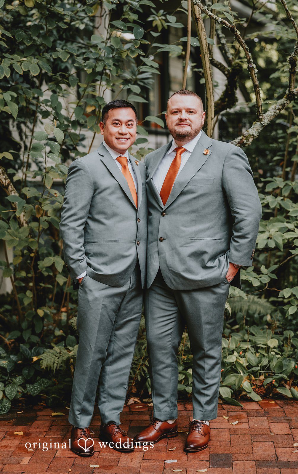 Benjamin + Tuan Couple standing side by side in gray suits at McMenamins Edgefield