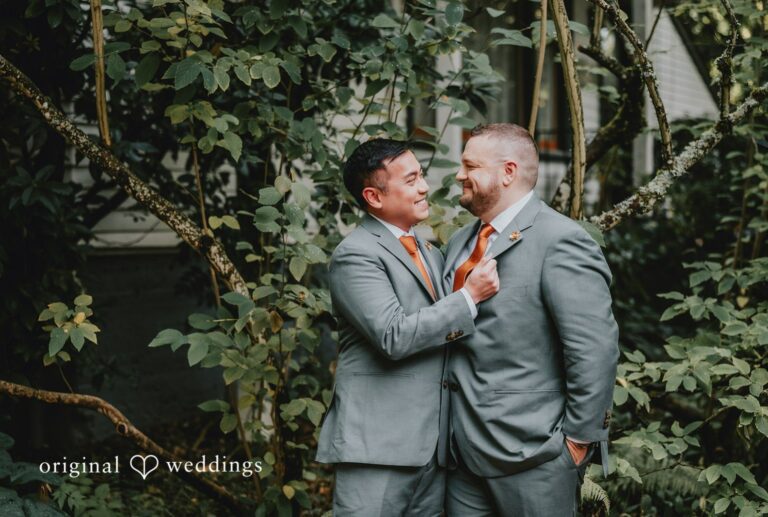 Grooms laughing together in the gardens, captured by Portland wedding photographers from Original Weddings at McMenamins Edgefield