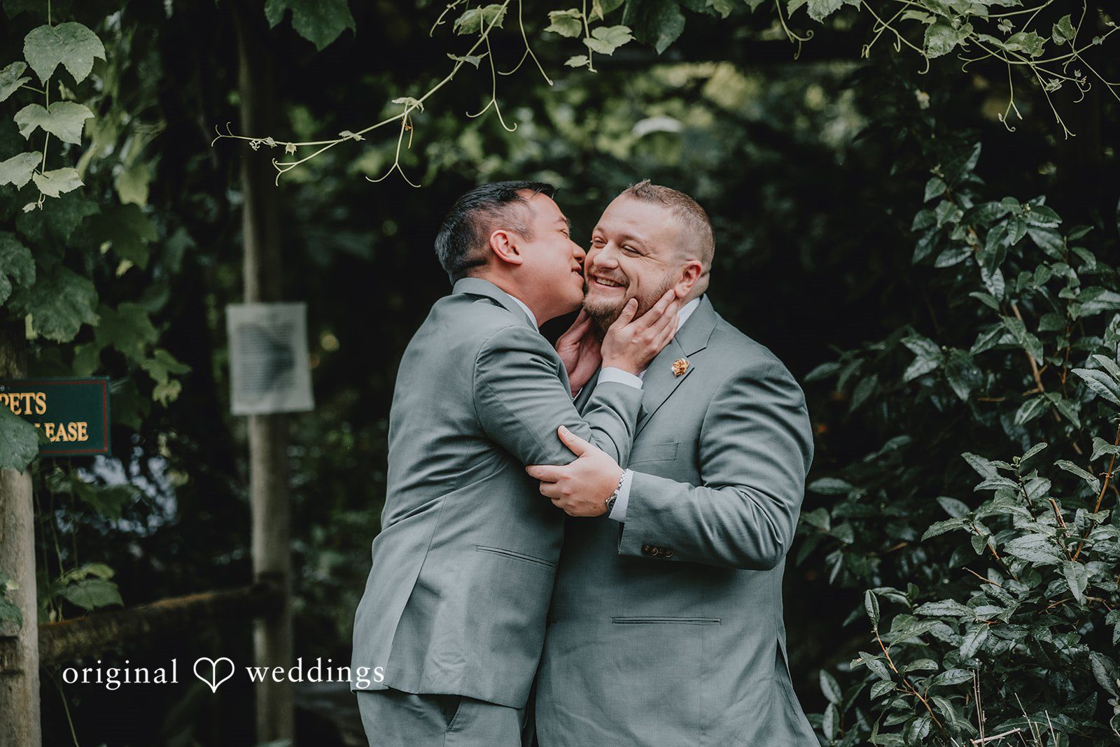 Benjamin + Tuan Grooms sharing a warm hug