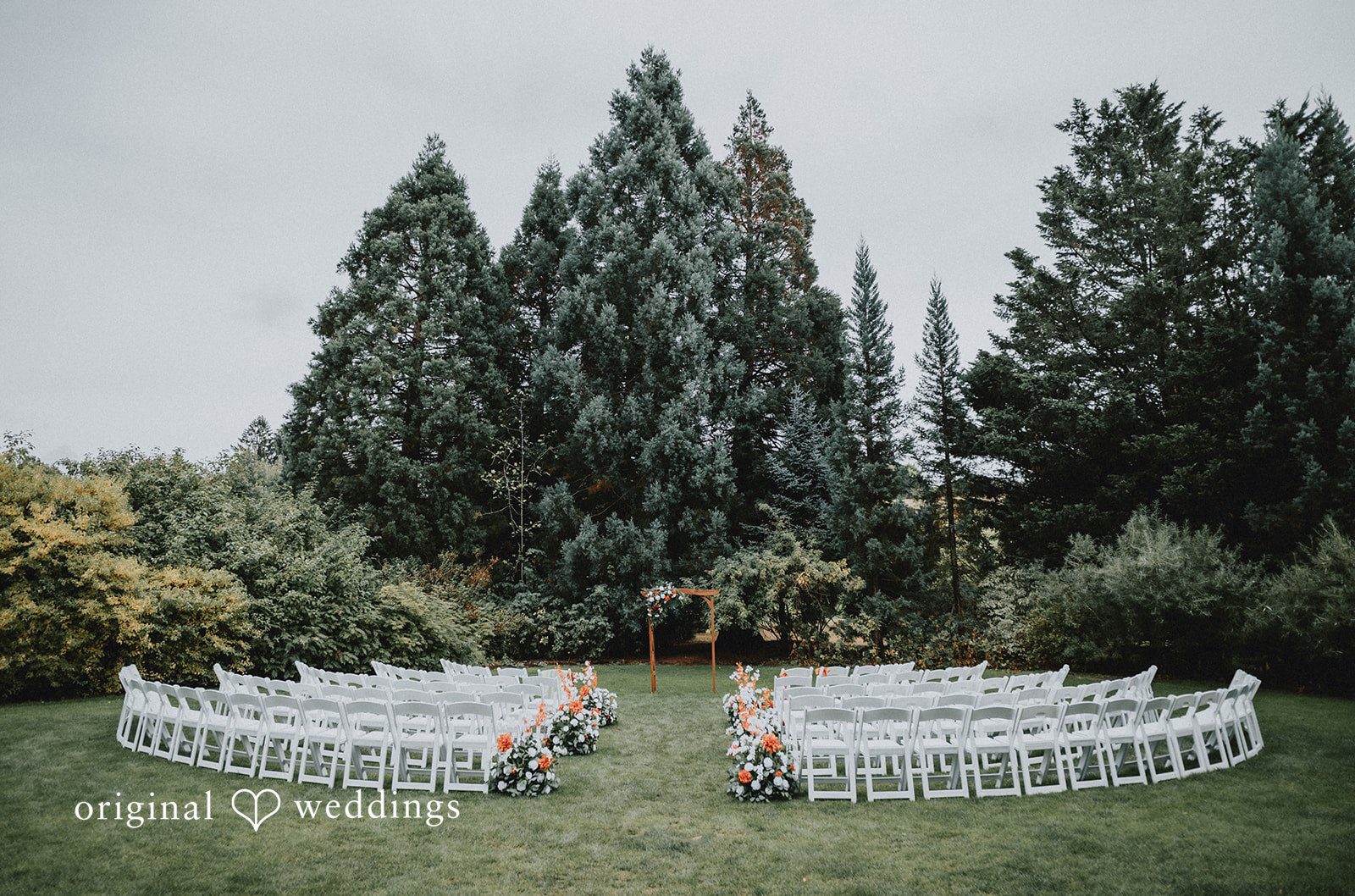 Benjamin + Tuan Lawn ceremony site with white chairs at McMenamins Edgefield
