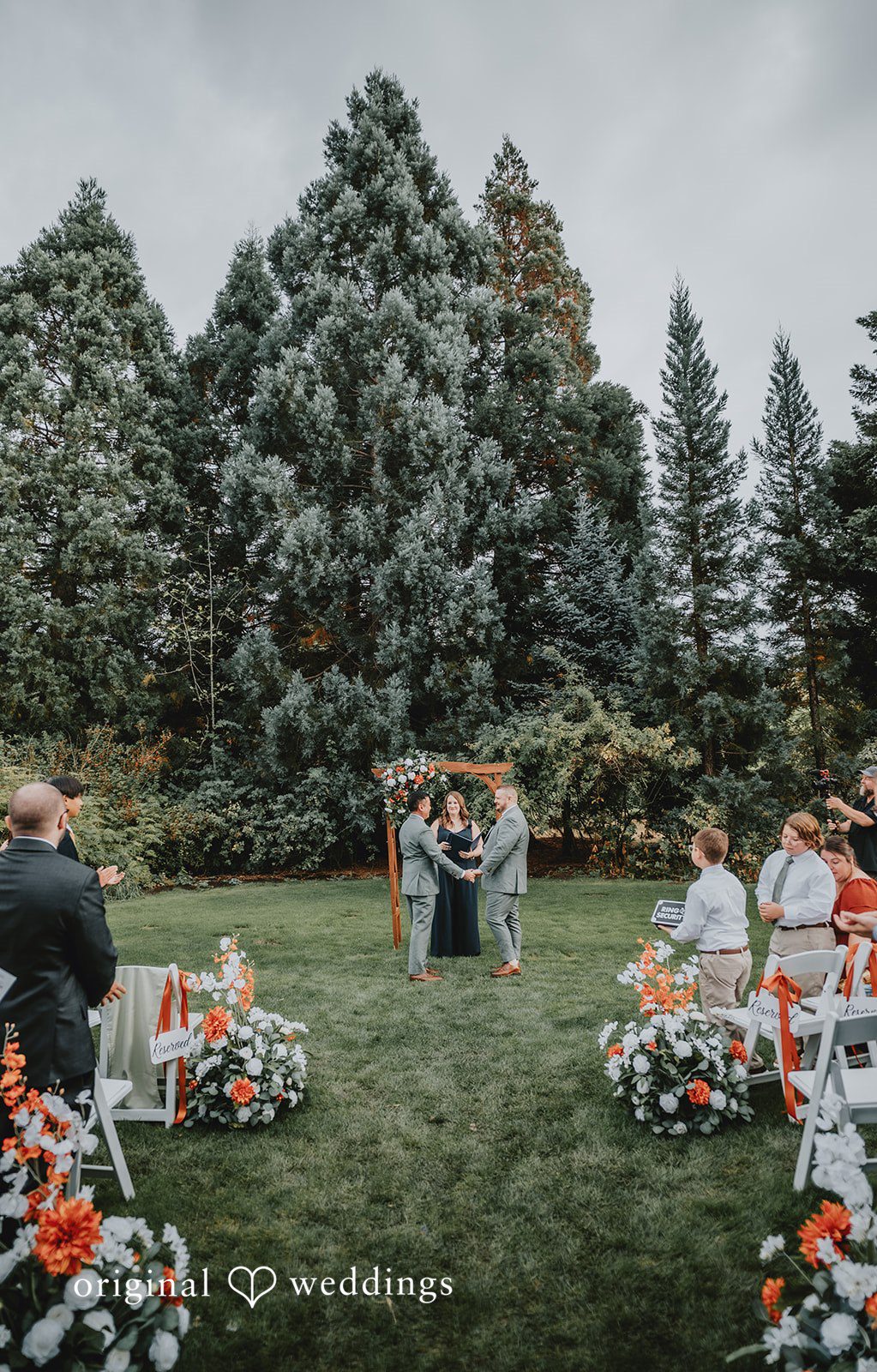 Benjamin + Tuan Wide view of the outdoor ceremony and aisle