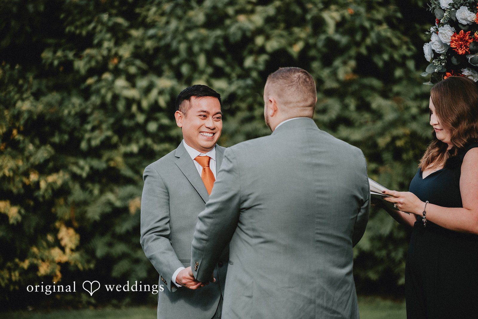 Benjamin + Tuan Newlyweds celebrating with guests after the ceremony