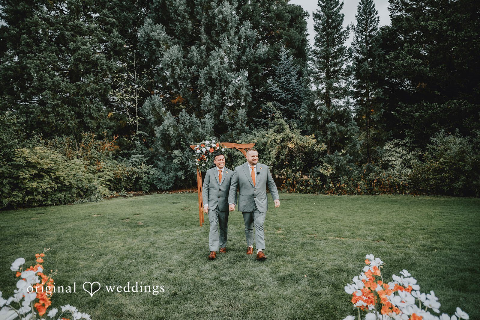 Benjamin + Tuan Grooms on the open lawn surrounded by trees