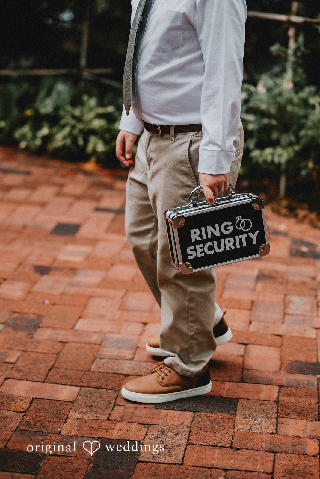Benjamin + Tuan Ring security sign carried down the aisle