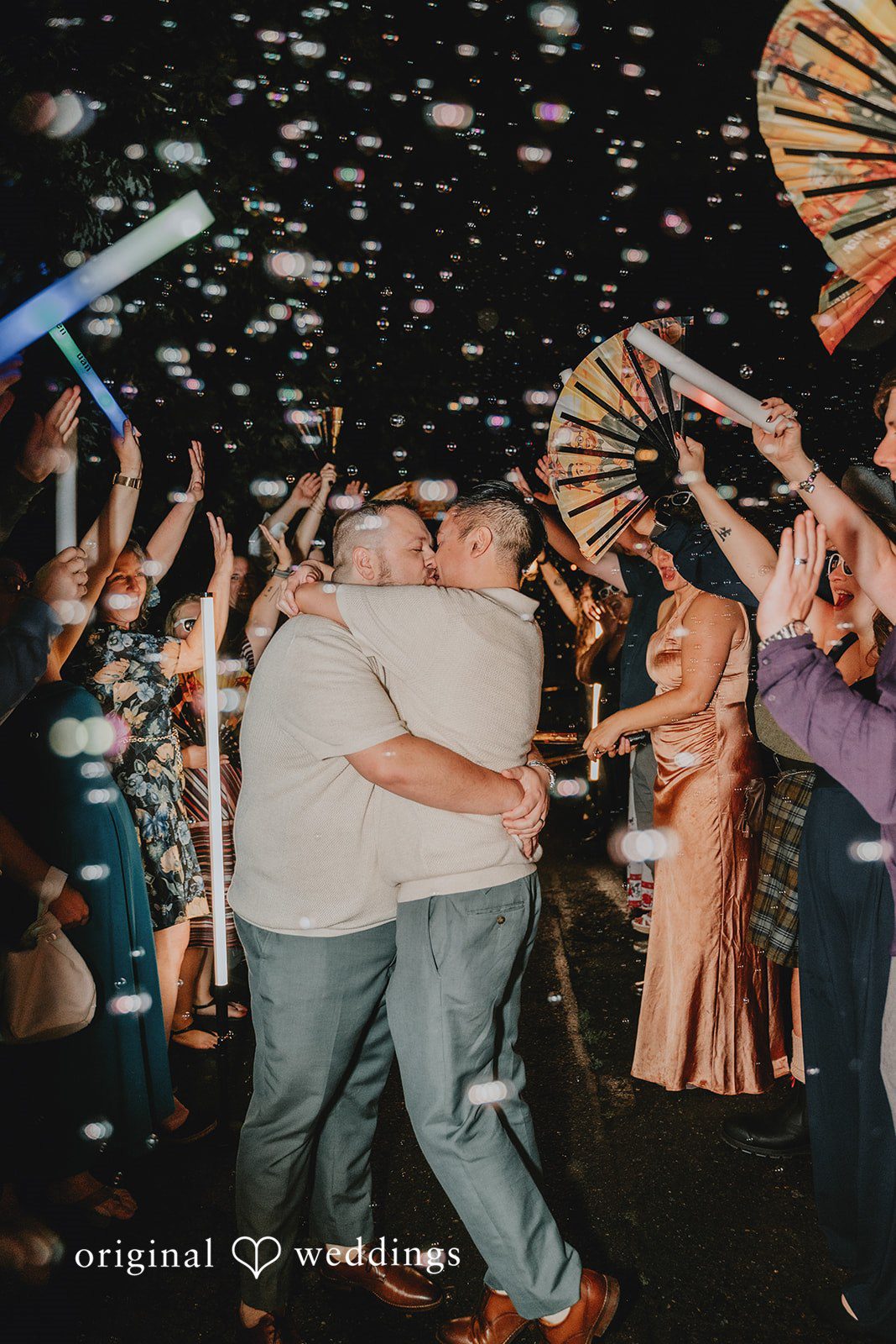 Benjamin + Tuan Guests dancing and cheering at the reception