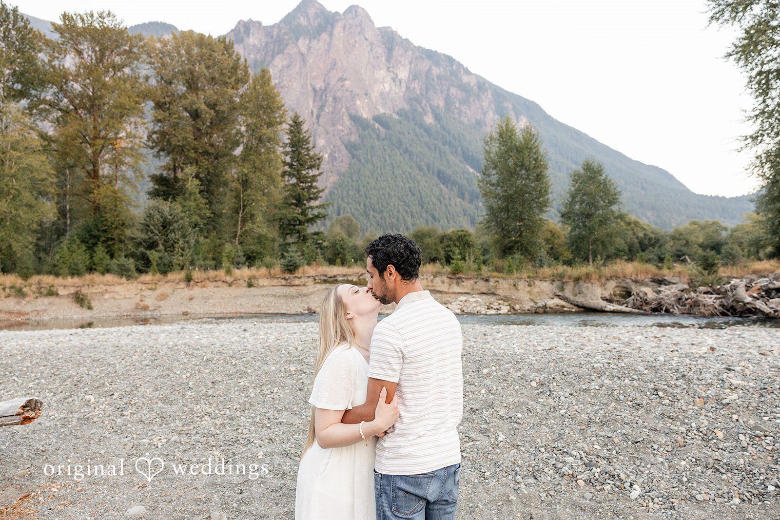 Leah + Joseph The couple shares a kiss in the outdoors