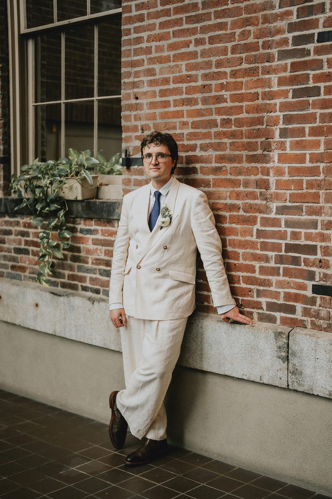 mechanics-hall-rustic-boston-brenna-walter-016-28 Groom posing by the brick wall