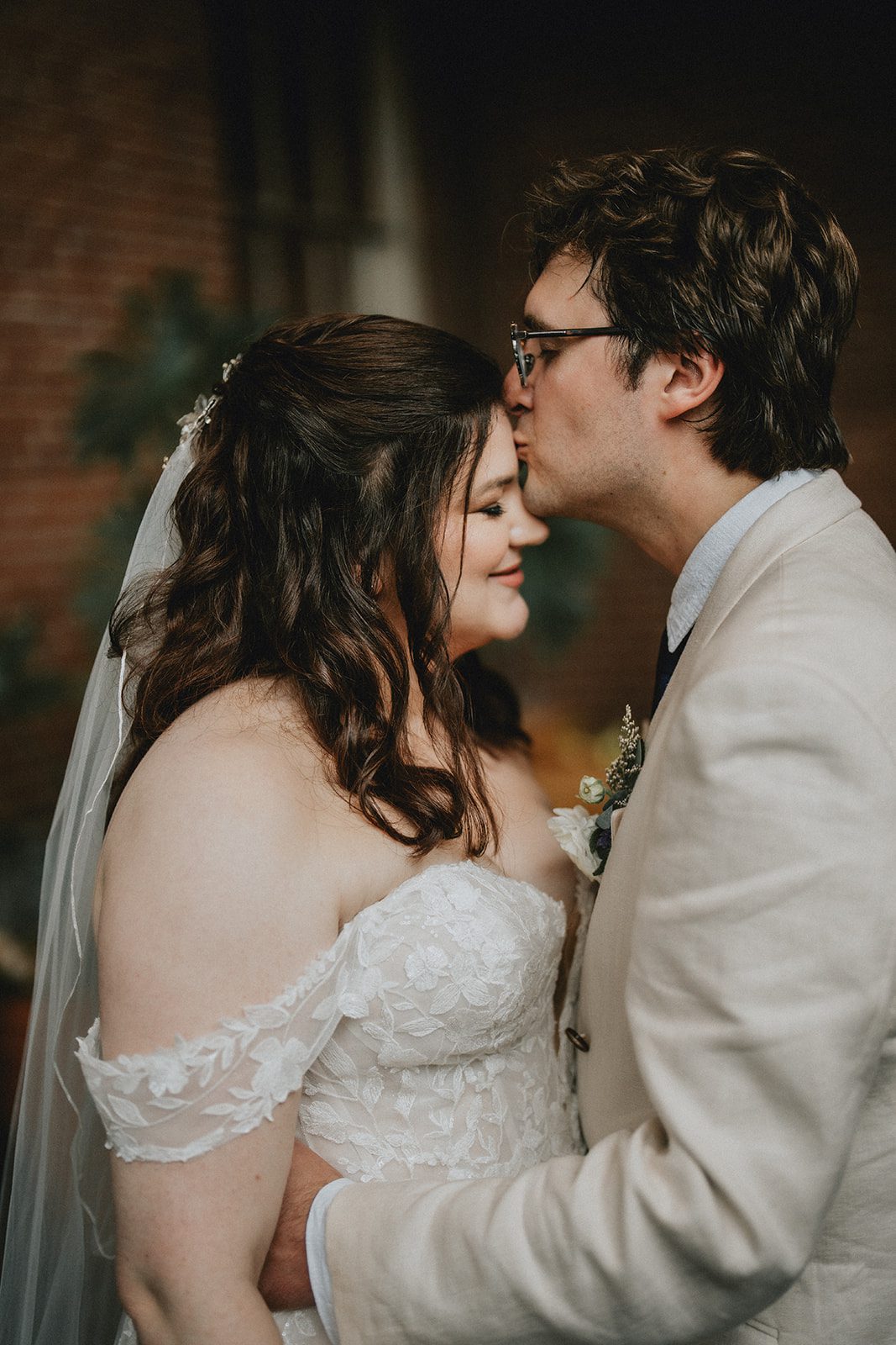 mechanics-hall-rustic-boston-brenna-walter-032-33 Bride and groom sharing a kiss