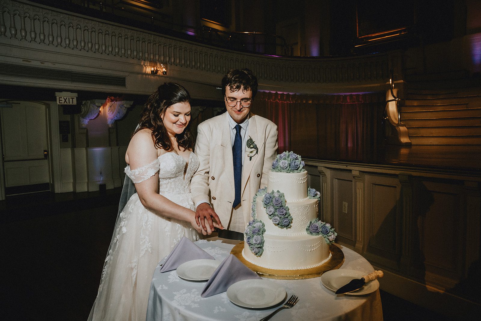 mechanics-hall-rustic-boston-brenna-walter-041-42 Couple cutting their wedding cake