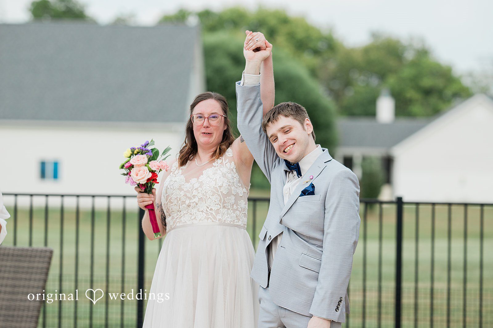 Our St. Louis wedding photographers captured a joyful moment of the couple from their Missouri Backyard Wedding Wedding venue: it's a Missouri Backyard Wedding