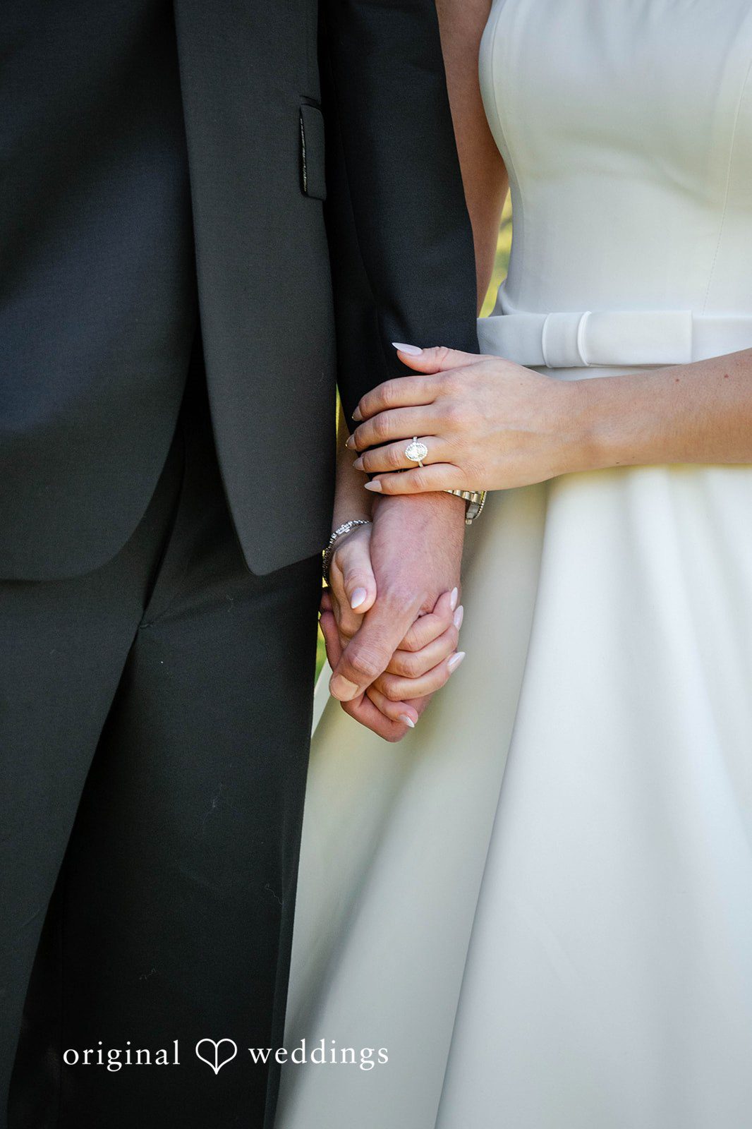 Couple holding hands close up