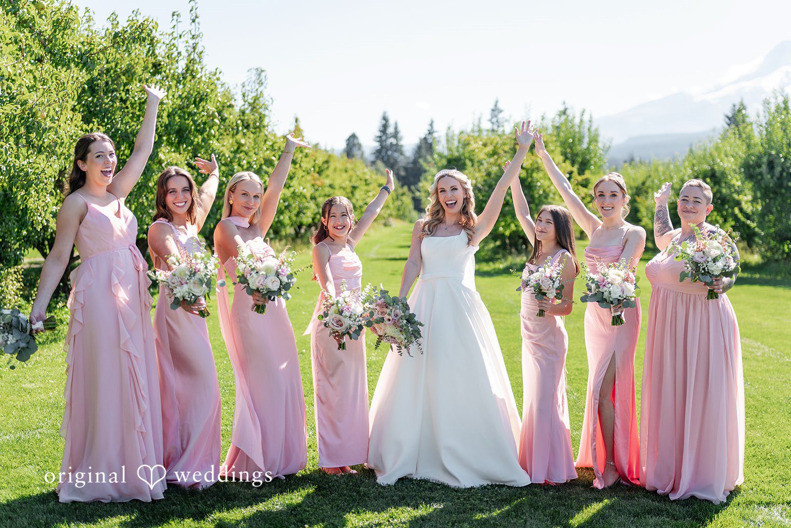 Bride with her bridesmaids in pink dresses