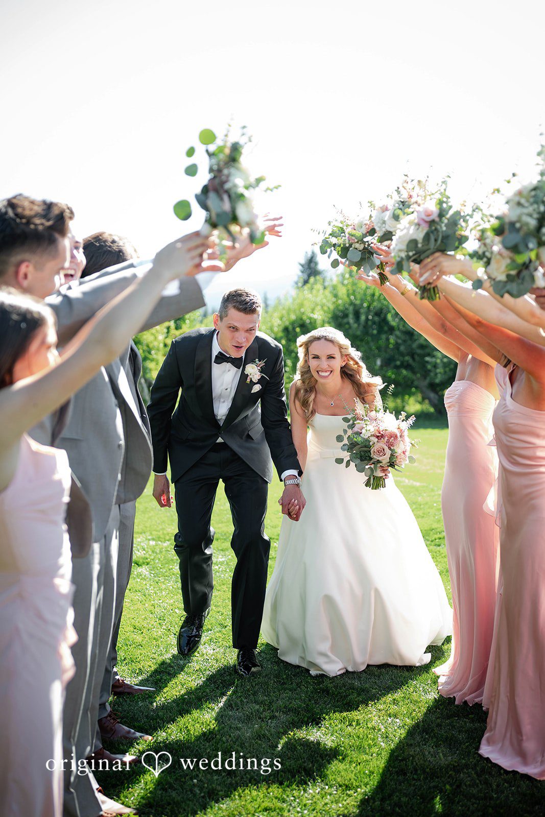 Bride hugging guests outdoors