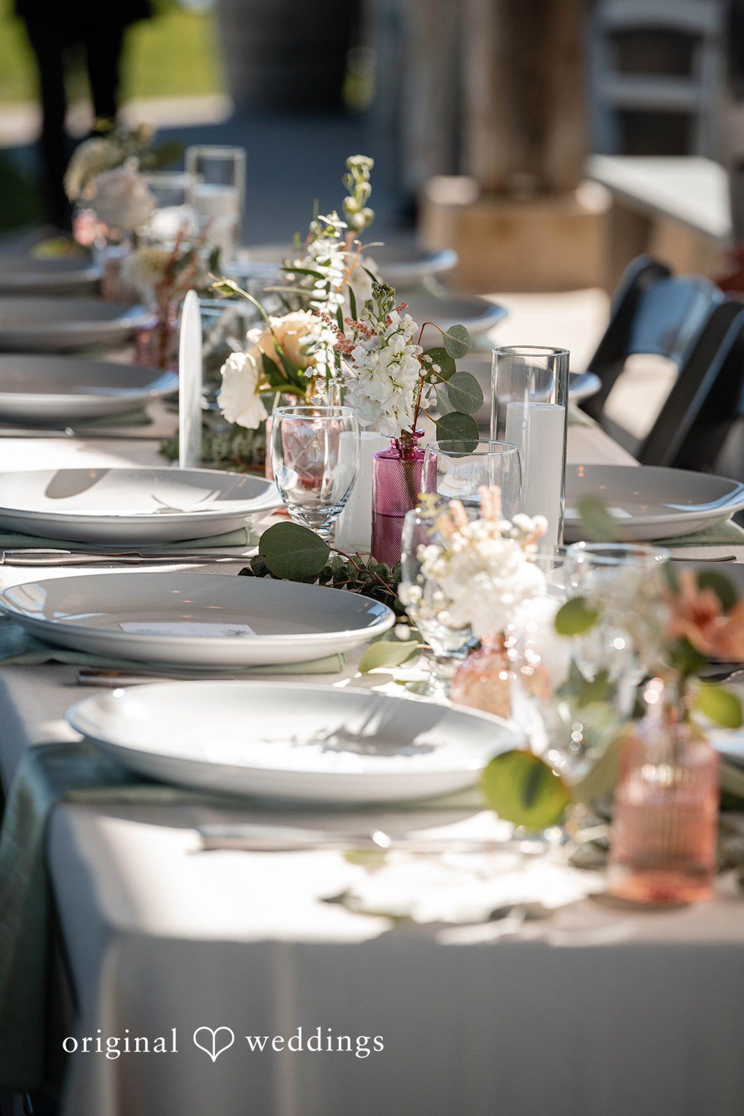 Reception tables set with white linens