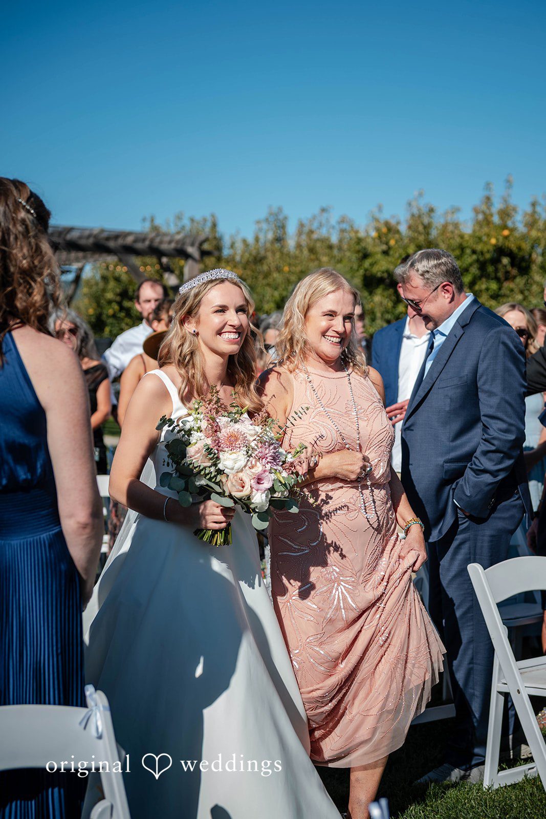 Bride cheering with her bridesmaids