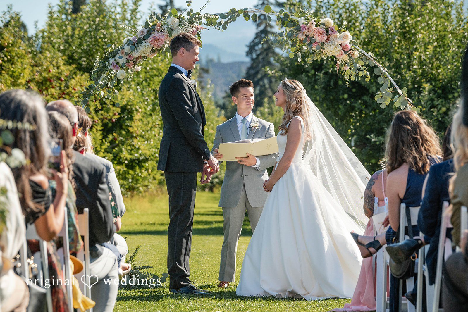 Couple holding hands at the ceremony