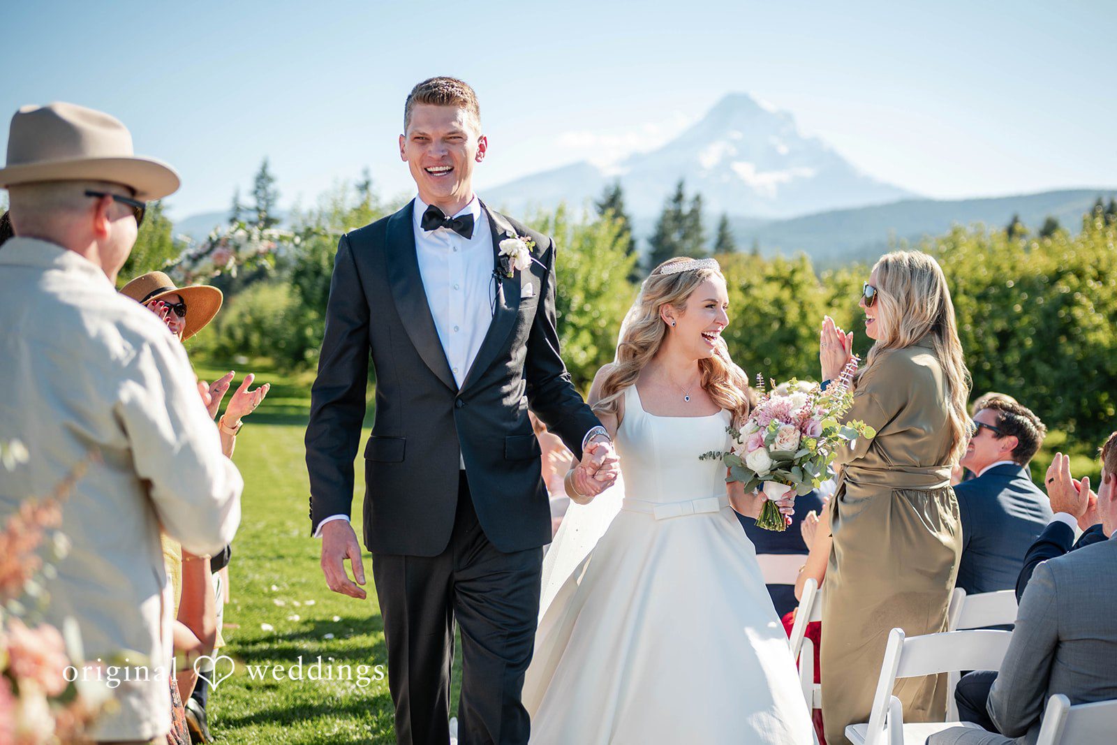 Couple entering the reception with Mount Hood in view