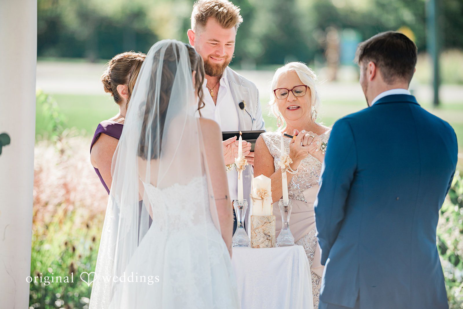 Kensey + Jordan Couple exchanging vows outdoors