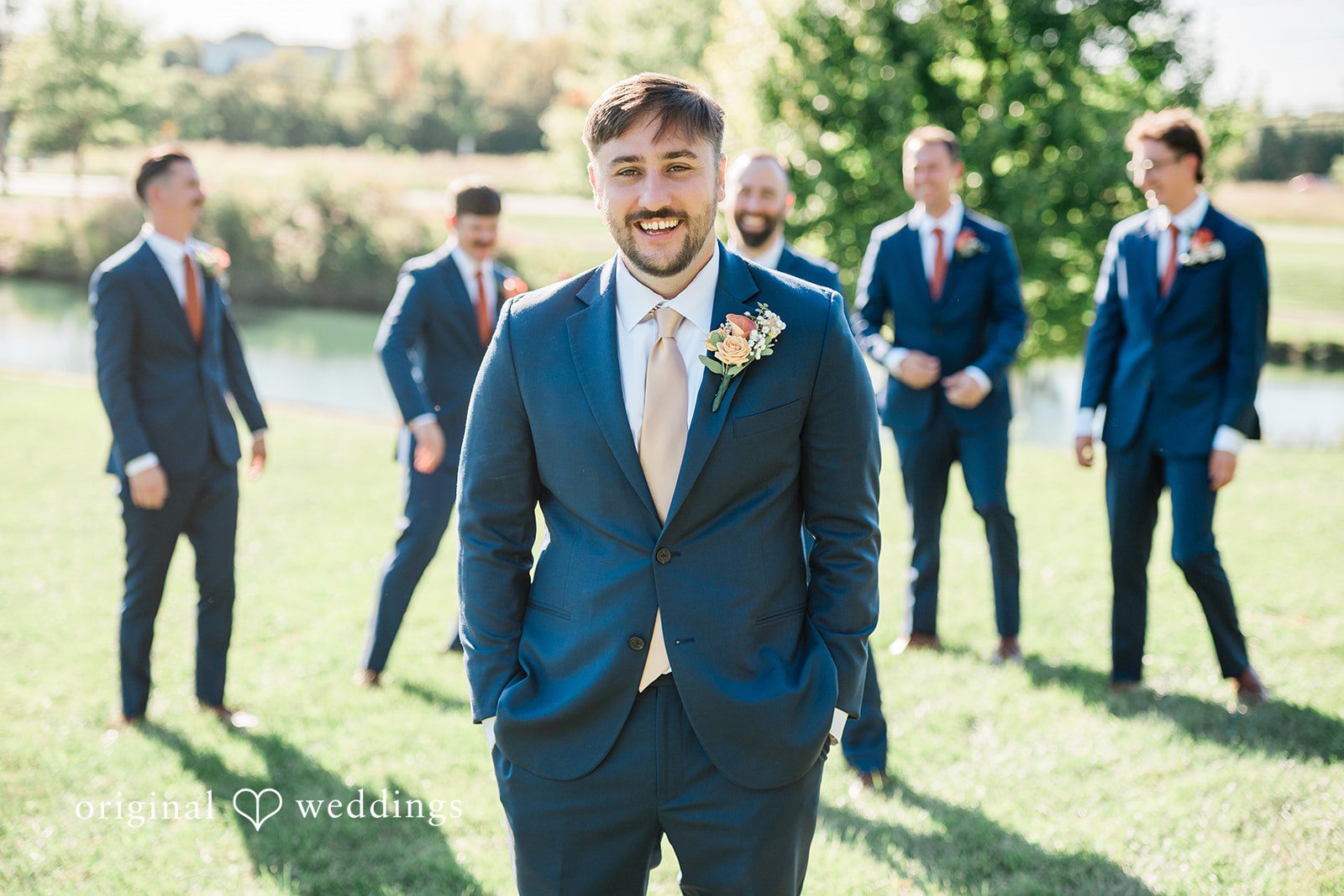 Kensey + Jordan Groom with his groomsmen in navy suits
