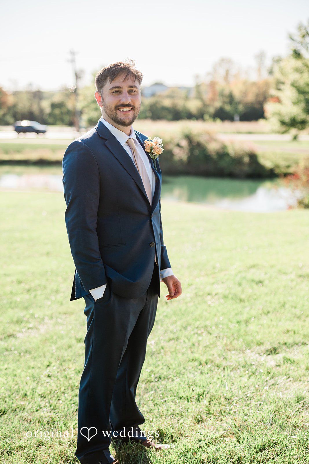 Kensey + Jordan Groom portrait on the lawn