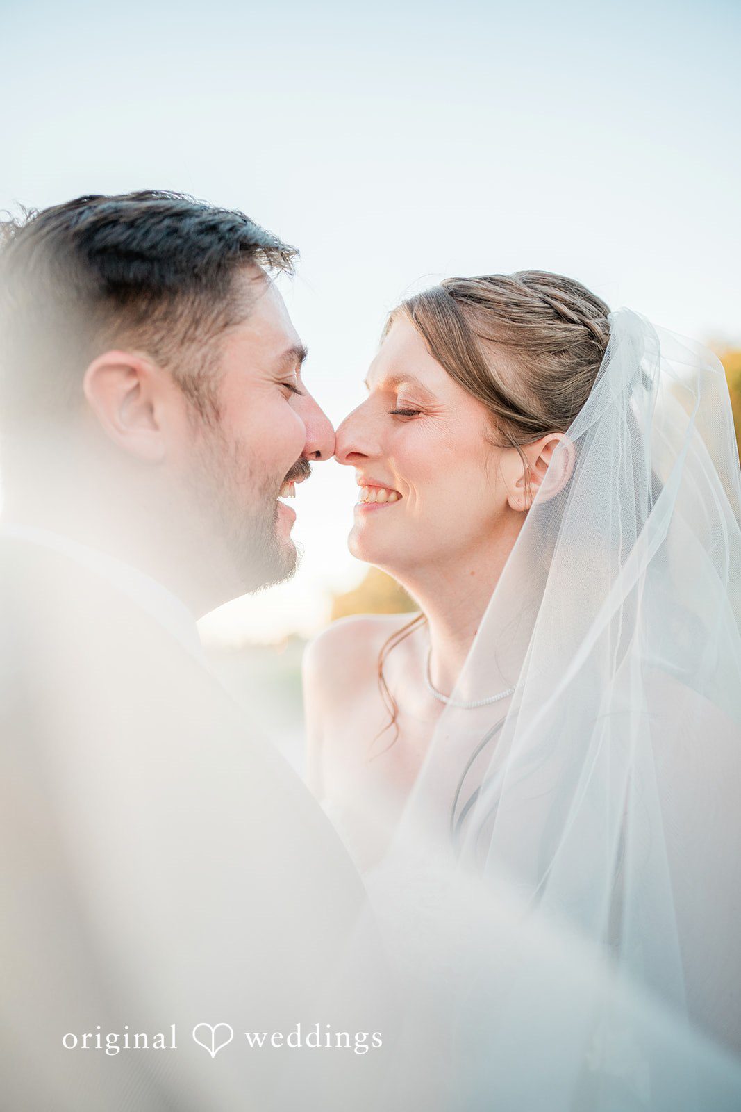 Kensey + Jordan Couple sharing a close moment, captured by Cincinnati wedding photographers from Original Weddings