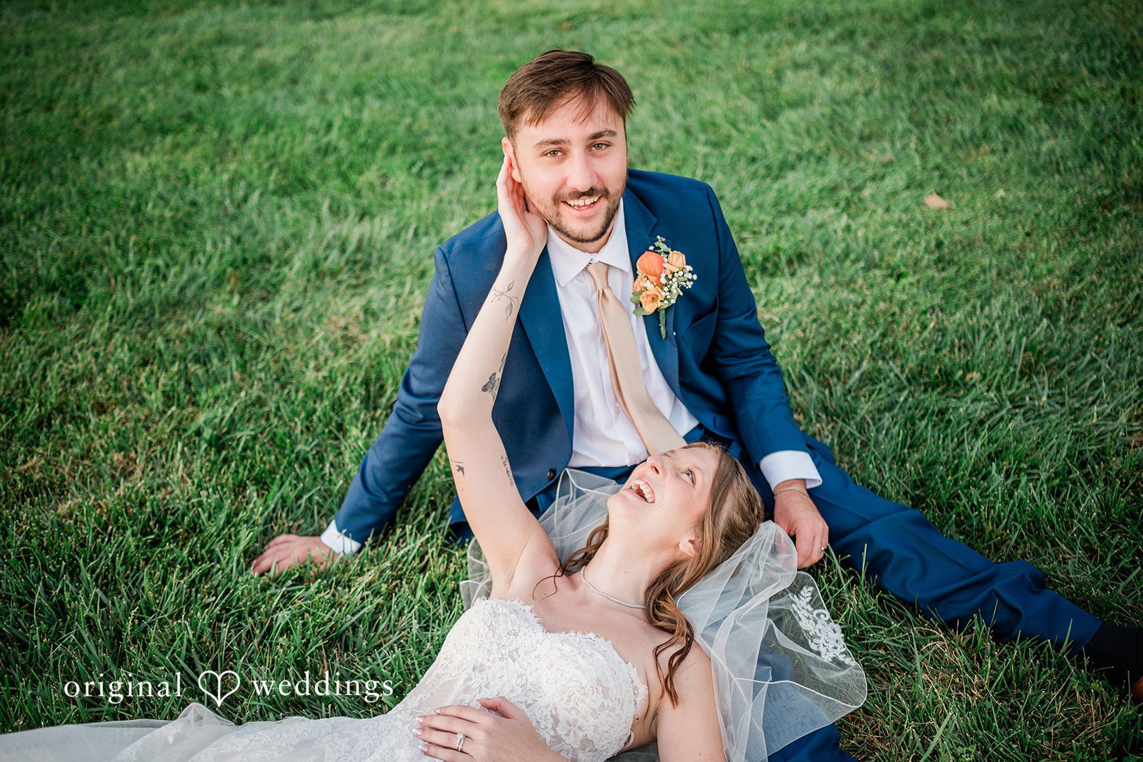 Kensey + Jordan Couple laughing on the grass
