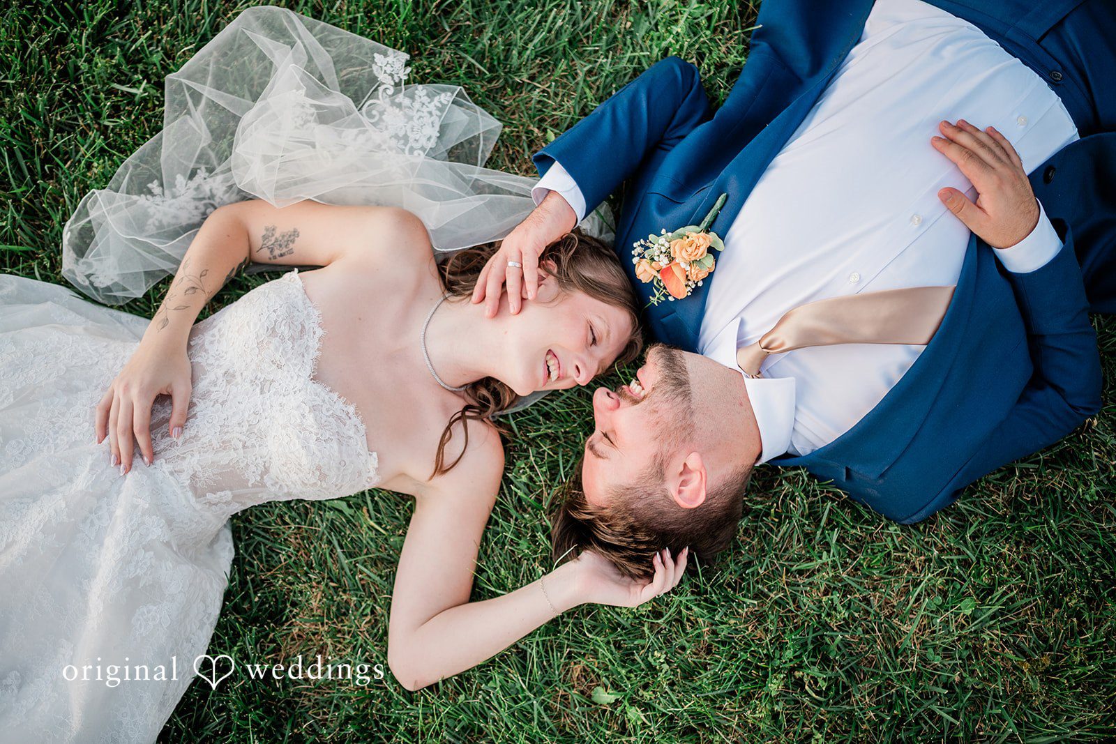 Kensey + Jordan Couple lying in the grass together