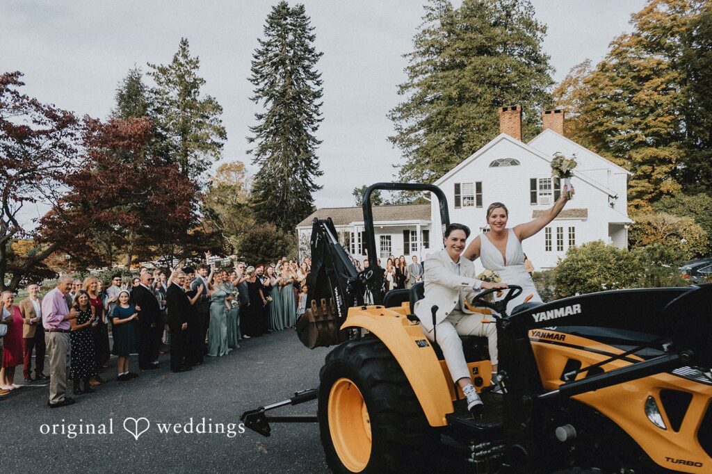 Rachel + Helen Our Hartford CT wedding photographers at Original Weddings captured the couple joyfully riding a farm tractor at New Pond Farm
