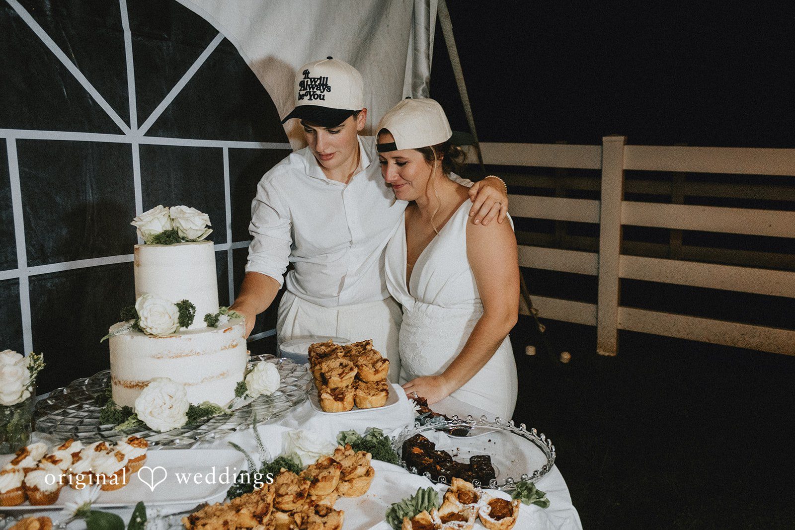 Rachel + Helen The couple cuts their wedding cake