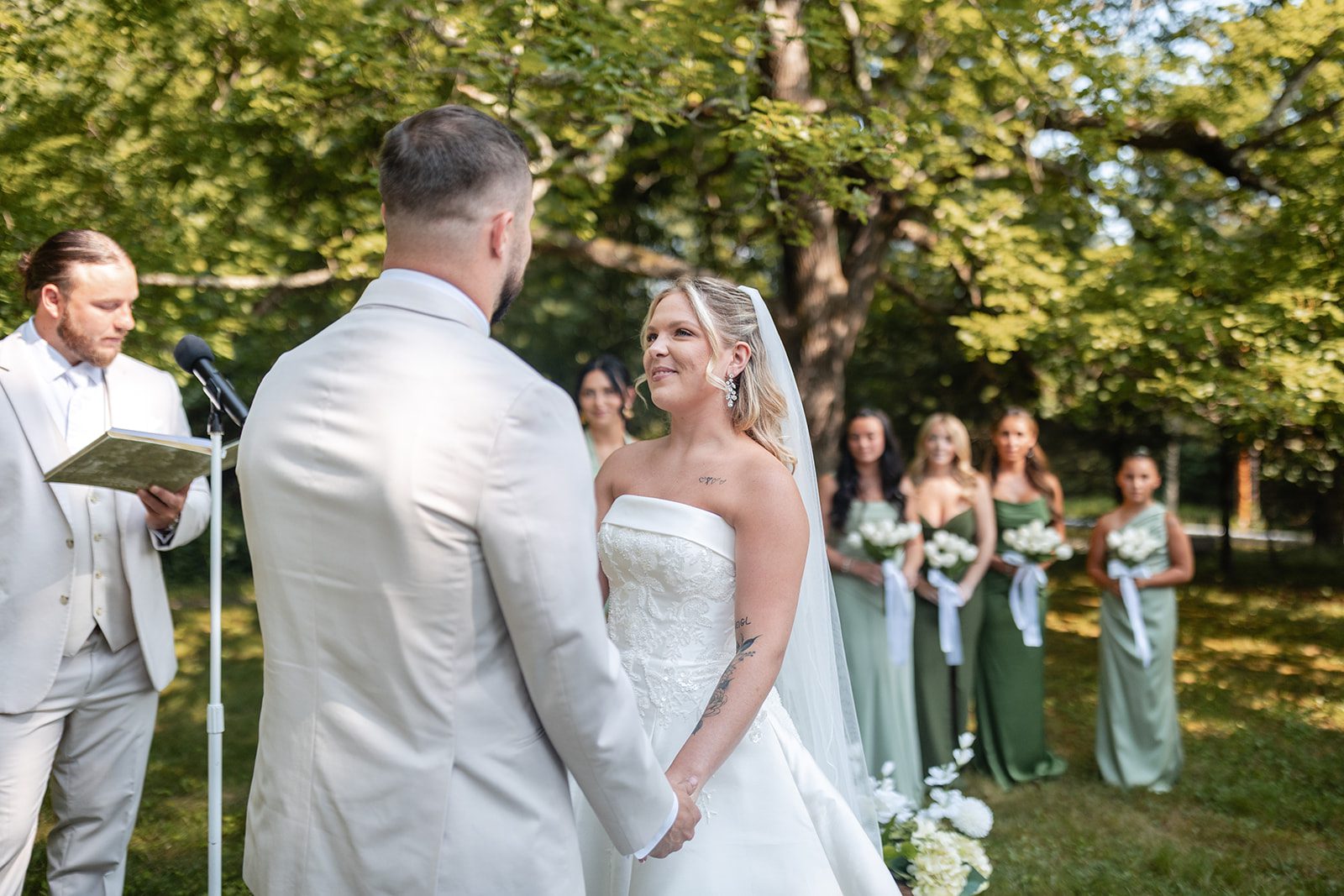 new-york-backyard-timeless-new-york-taylor-andrew-p011-27 Couple facing each other during the garden ceremony