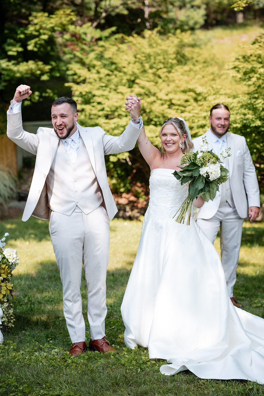 new-york-backyard-timeless-new-york-taylor-andrew-p015-07 Newlyweds celebrating down the aisle at a New York backyard wedding