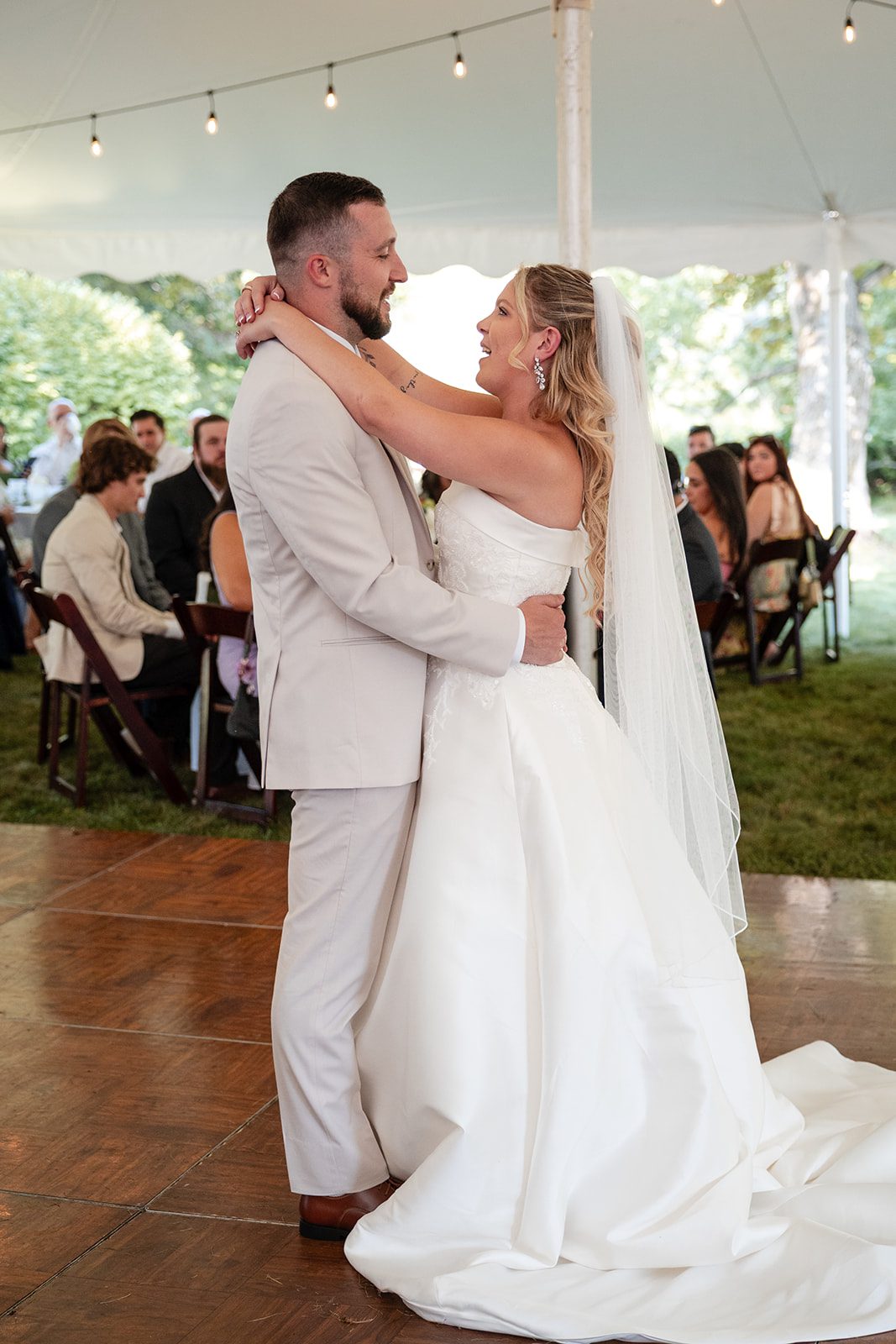 new-york-backyard-timeless-new-york-taylor-andrew-p025-20 Couple dancing under the tent lights at a New York backyard wedding