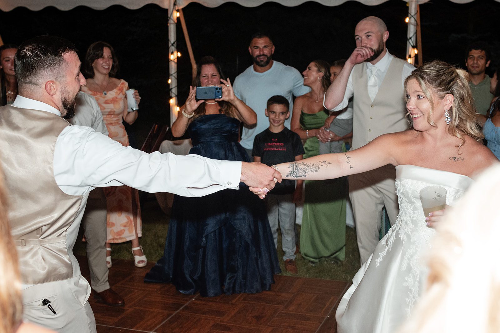 new-york-backyard-timeless-new-york-taylor-andrew-p028-16 Guests dancing around the newlyweds