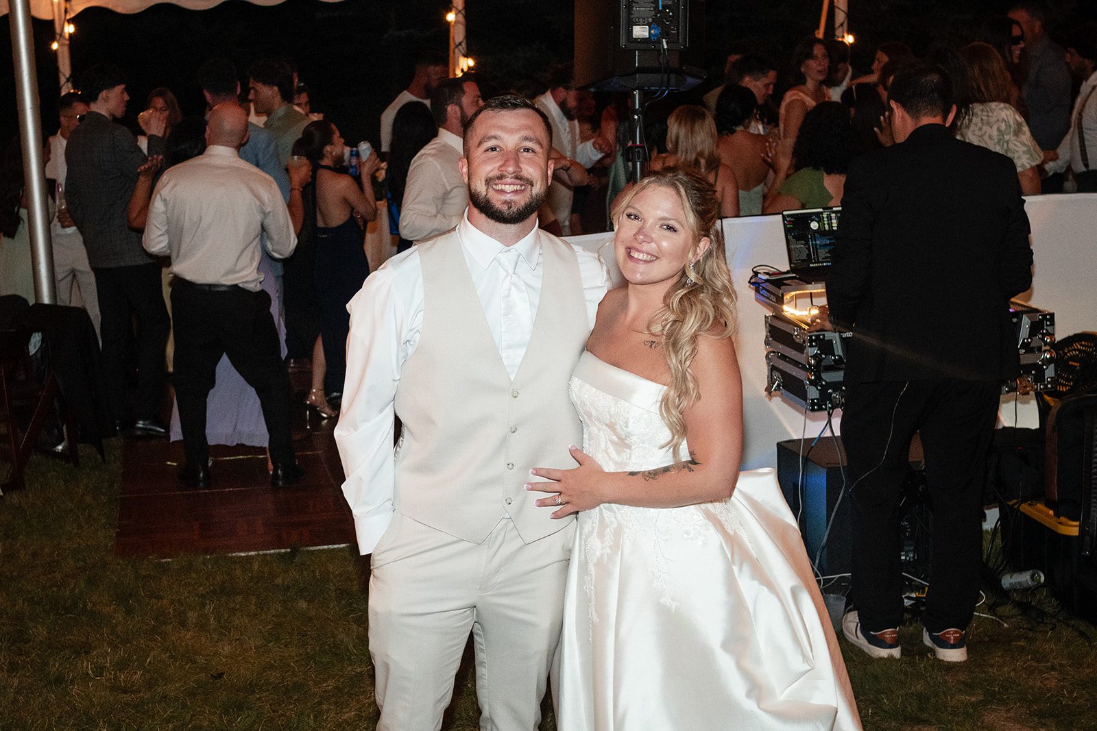 new-york-backyard-timeless-new-york-taylor-andrew-p031-03 Newlyweds celebrating with their guests at a New York backyard wedding