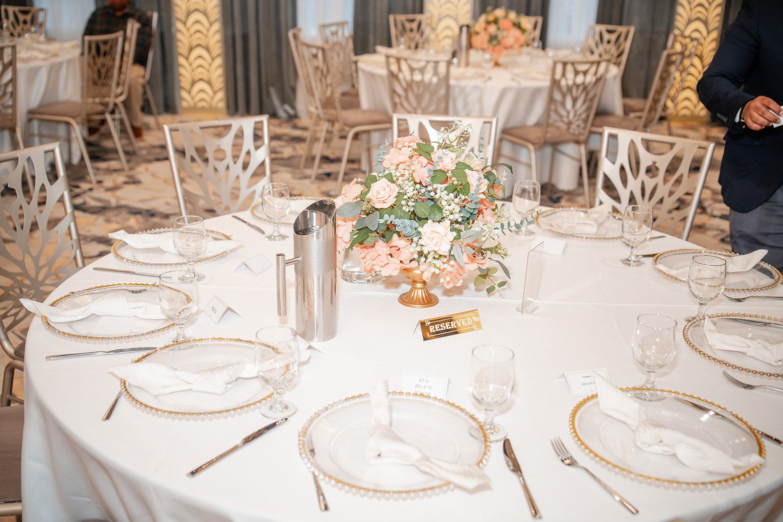 nuur-event-center-timeless-denver-henok-elshadaye-p003-25 Reception table set with gold chargers at Nuur Event Center