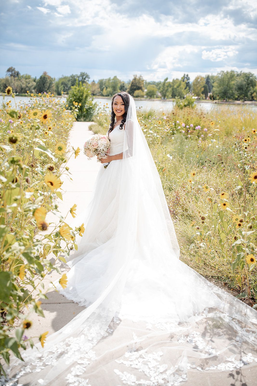 nuur-event-center-timeless-denver-henok-elshadaye-p004-26 Bride in her gown among summer flowers