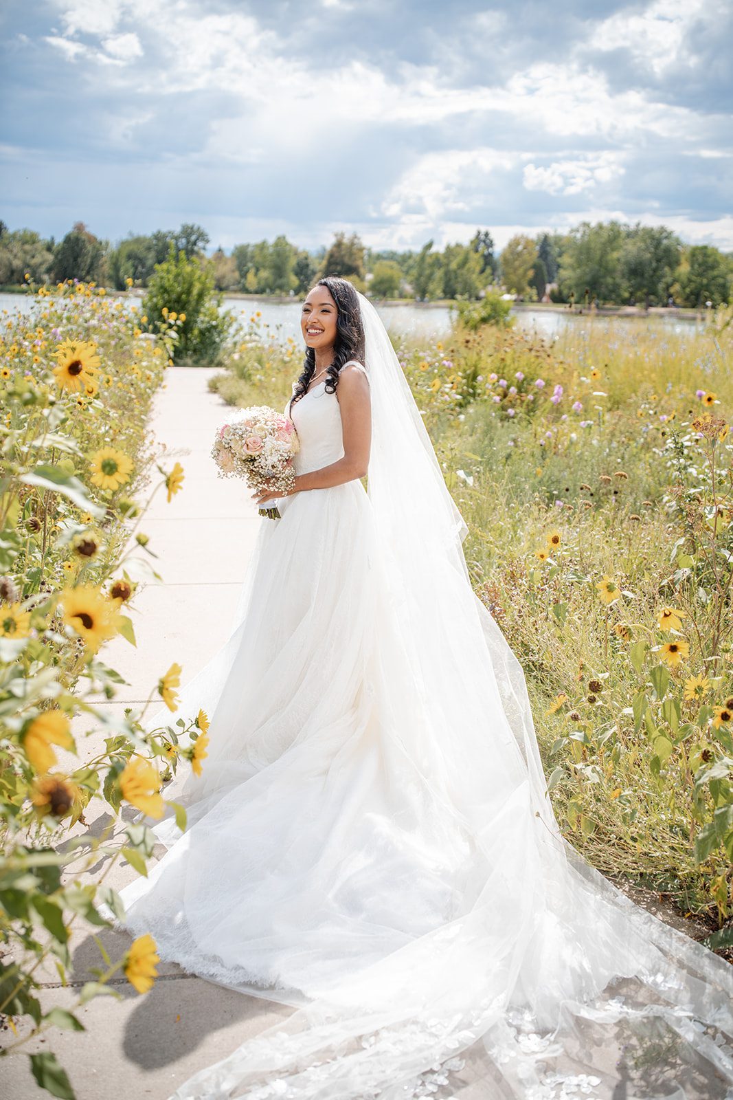 nuur-event-center-timeless-denver-henok-elshadaye-p005-32 Bride showing off her long cathedral veil