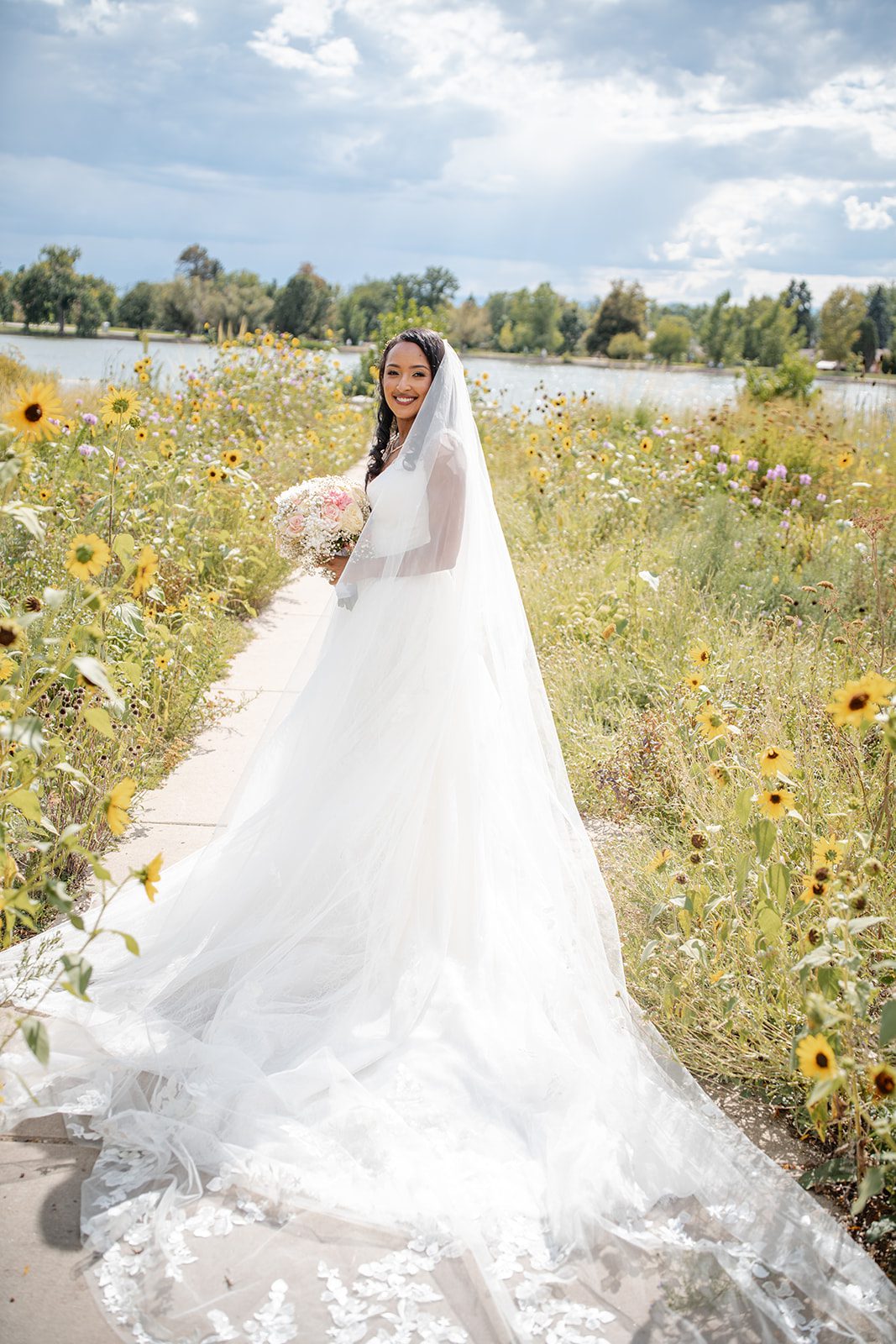 nuur-event-center-timeless-denver-henok-elshadaye-p006-07 Bride walking along a garden path