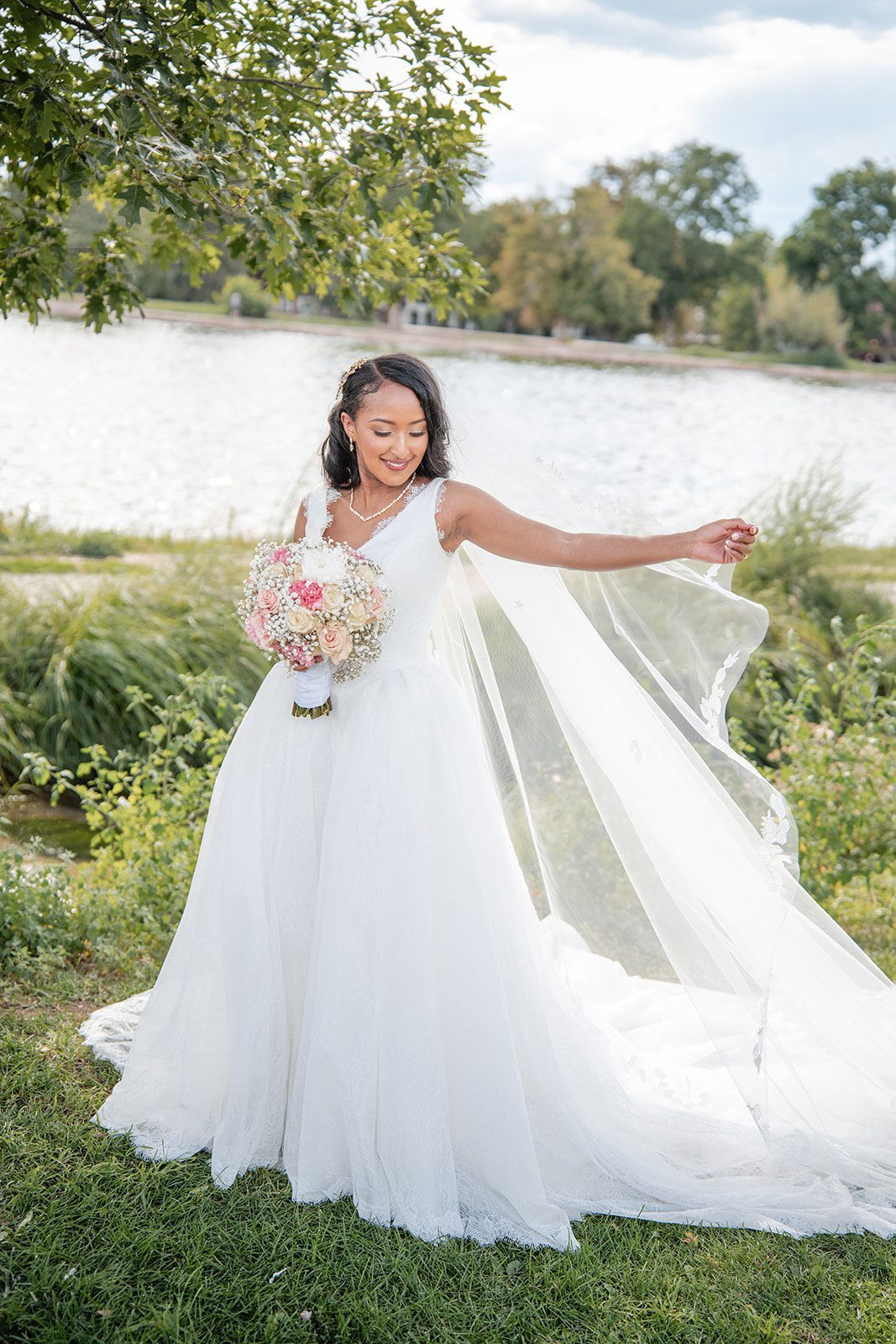 nuur-event-center-timeless-denver-henok-elshadaye-p007-21 Bride smiling by the water