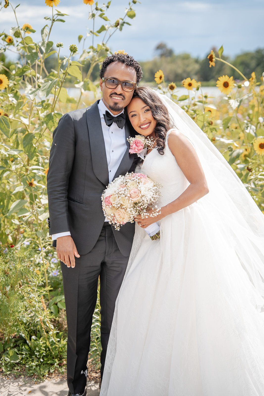 nuur-event-center-timeless-denver-henok-elshadaye-p014-41 Bride and groom among the sunflowers