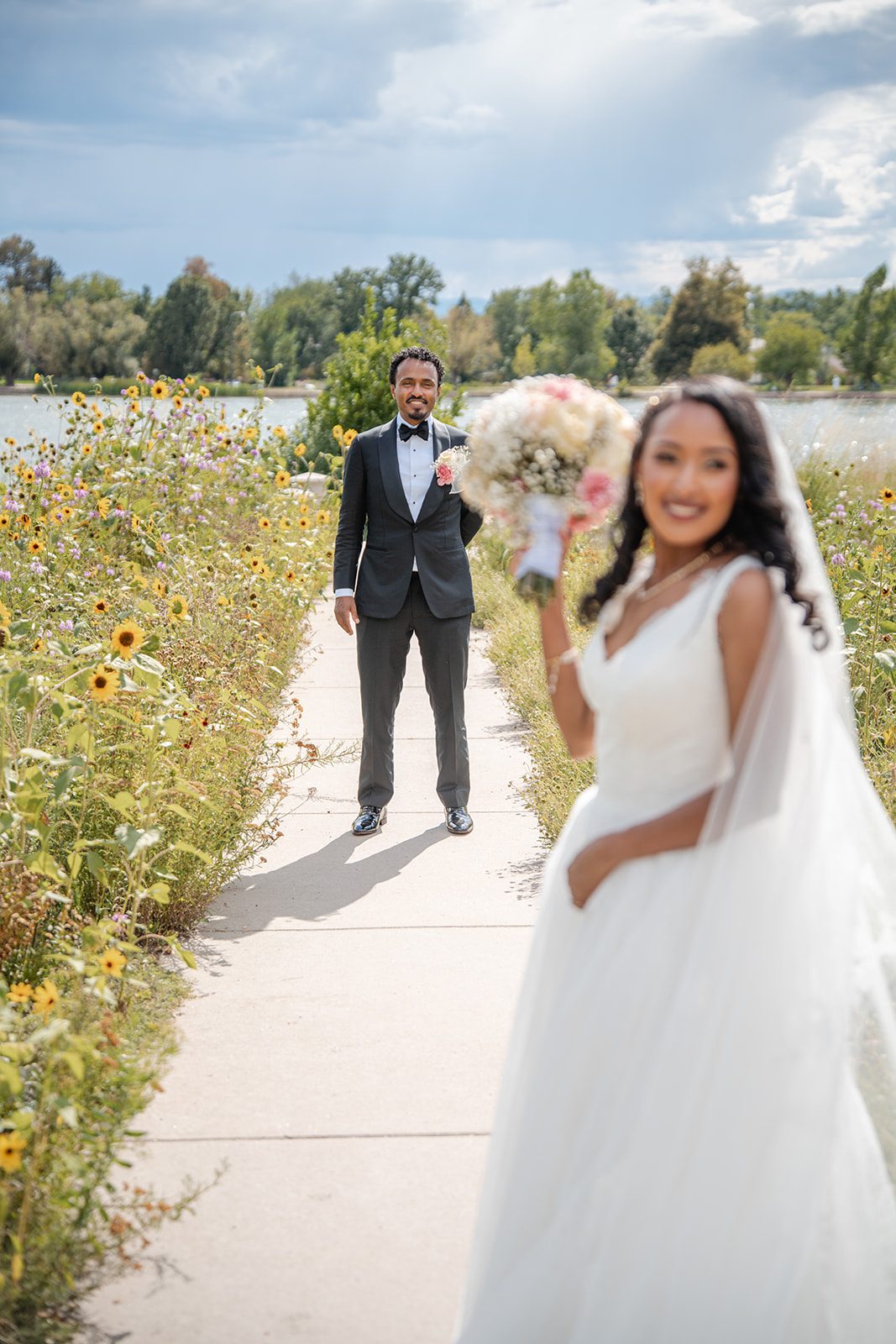 nuur-event-center-timeless-denver-henok-elshadaye-p017-04 Couple walking together on a garden path