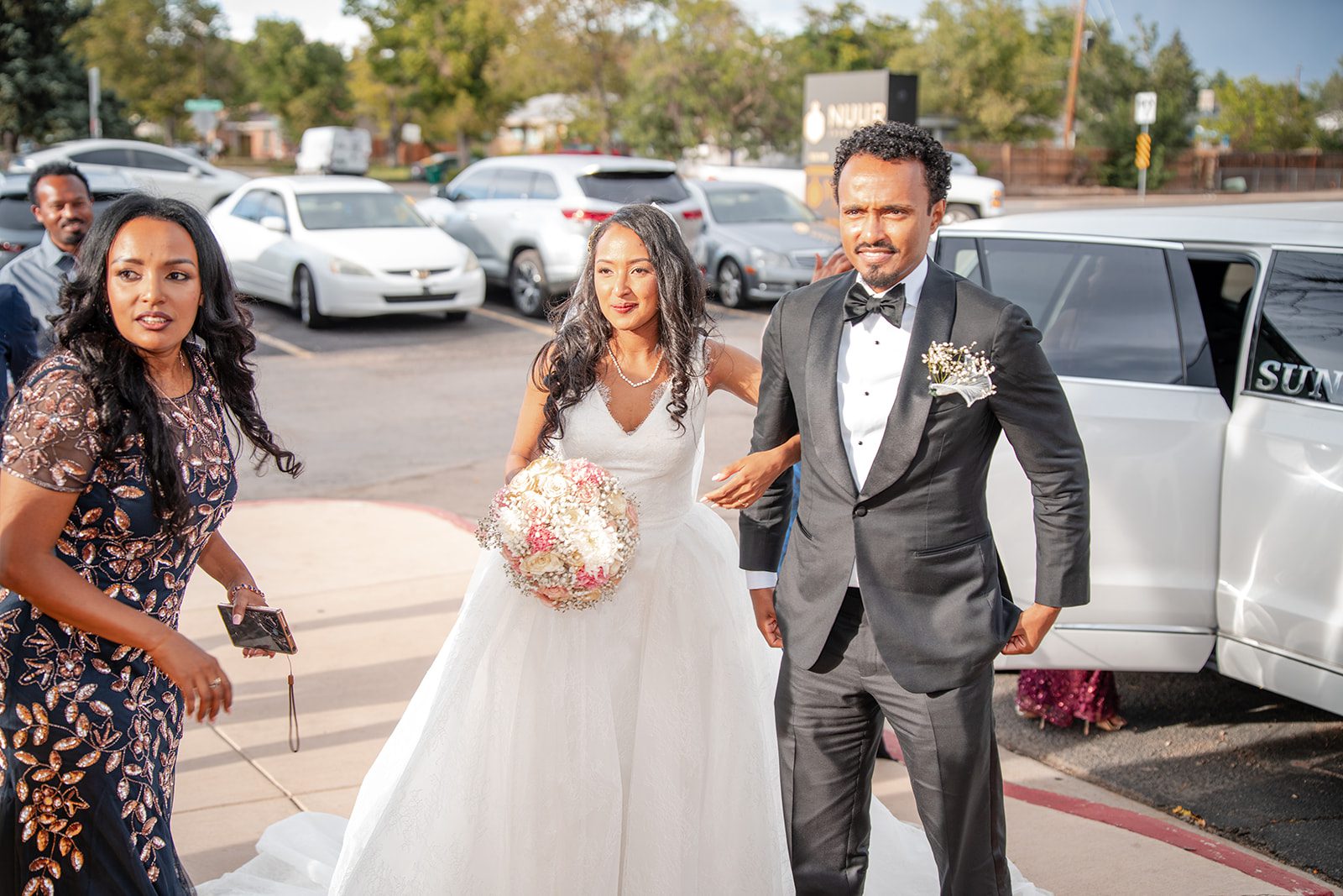 nuur-event-center-timeless-denver-henok-elshadaye-p027-30 Newlyweds arriving with their guests
