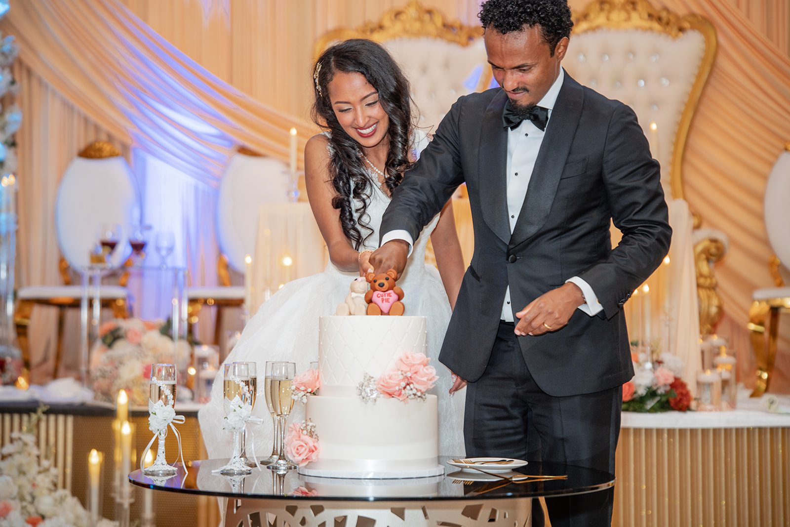 nuur-event-center-timeless-denver-henok-elshadaye-p030-36 Couple feeding each other cake