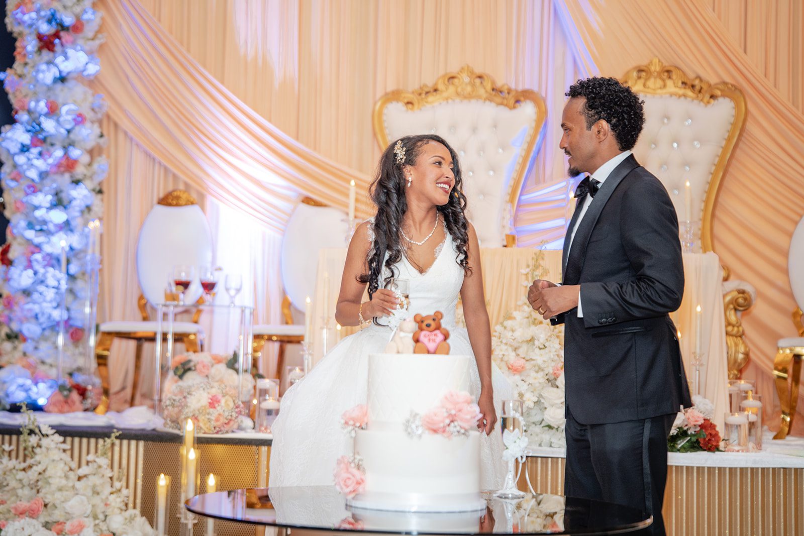 nuur-event-center-timeless-denver-henok-elshadaye-p033-10 Newlyweds sharing a moment at the head table
