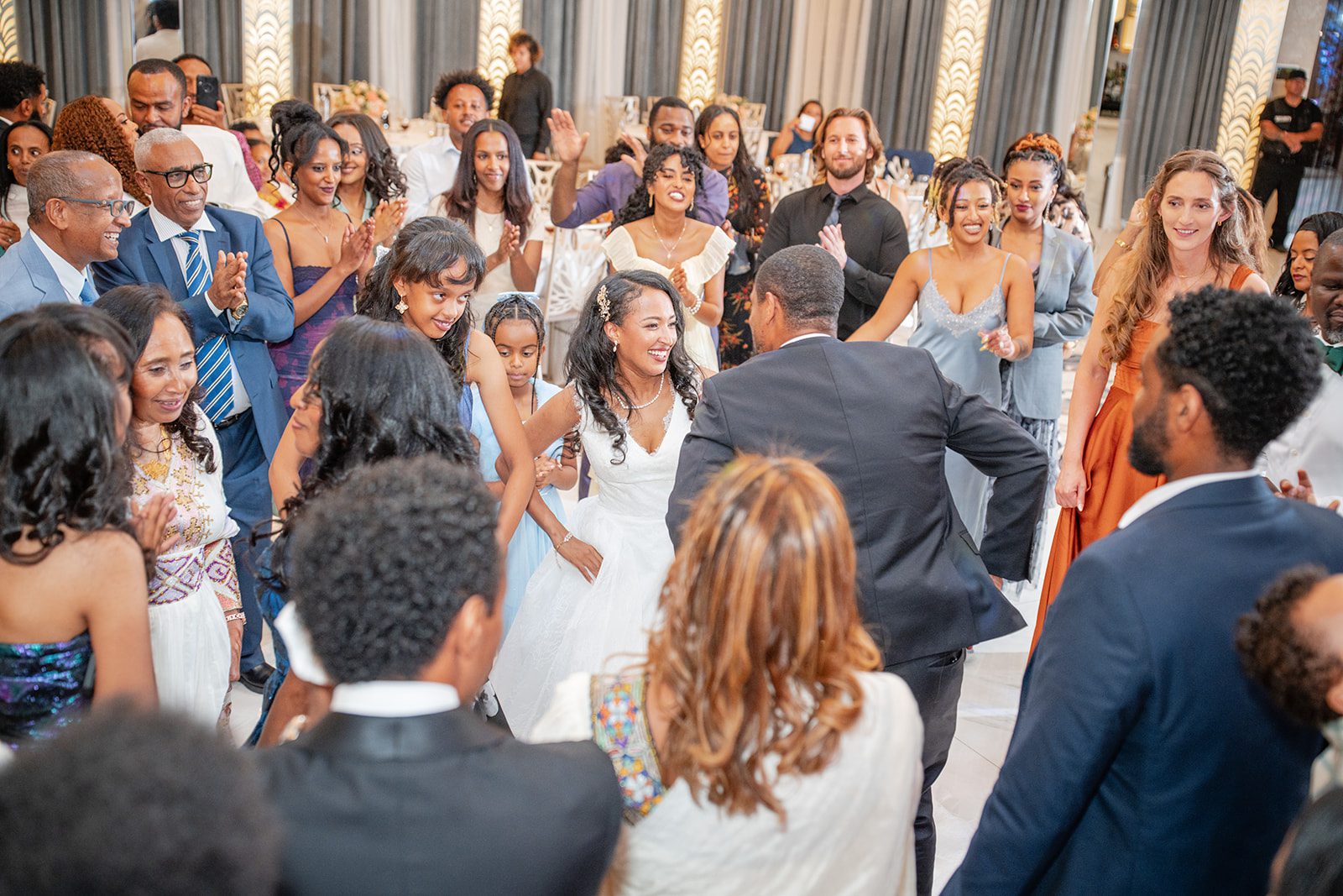 nuur-event-center-timeless-denver-henok-elshadaye-p039-34 Packed dance floor at the reception at Nuur Event Center