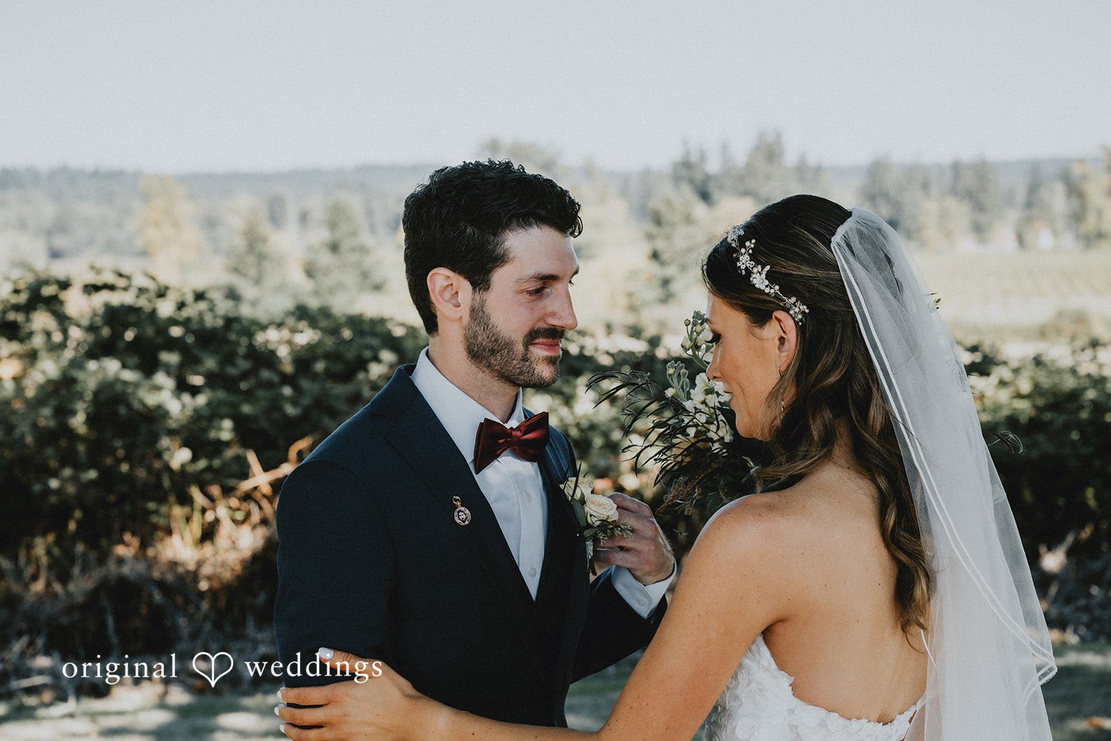 Bride and groom sharing a sweet moment outdoors, captured by Portland wedding photographers from Original Weddings at Oak & Hood