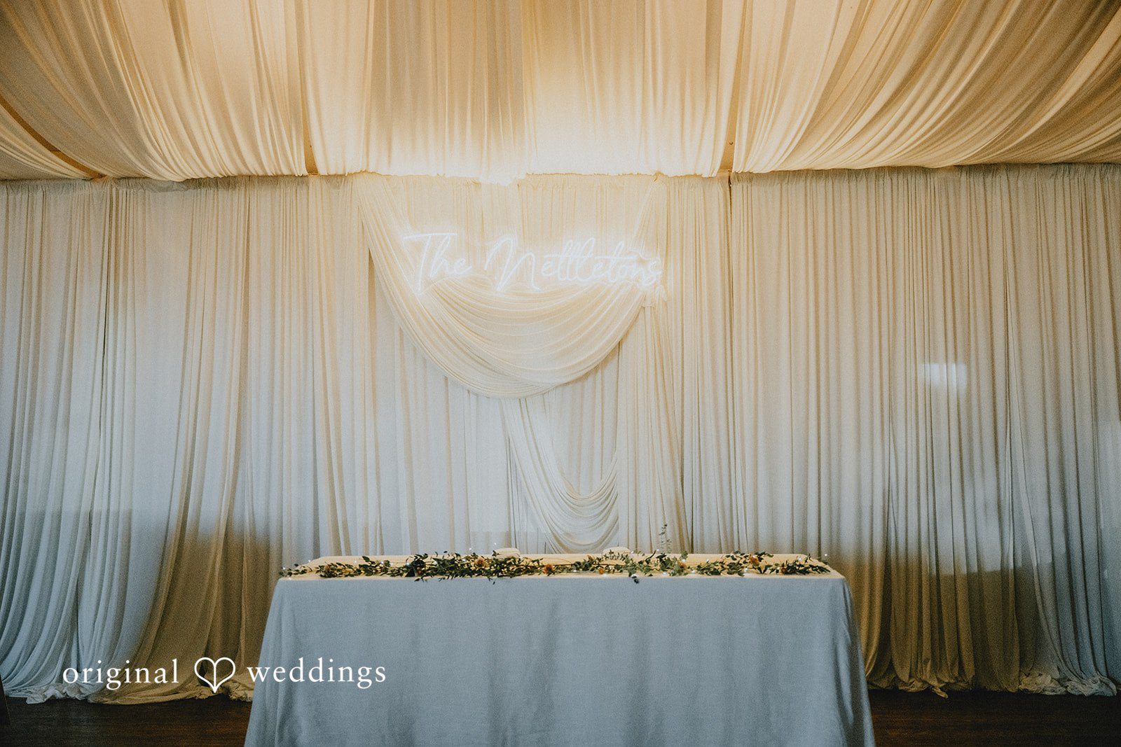 Draped head table ready for the reception